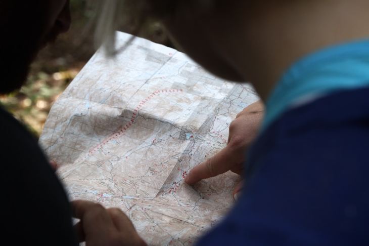 People pointing at a map