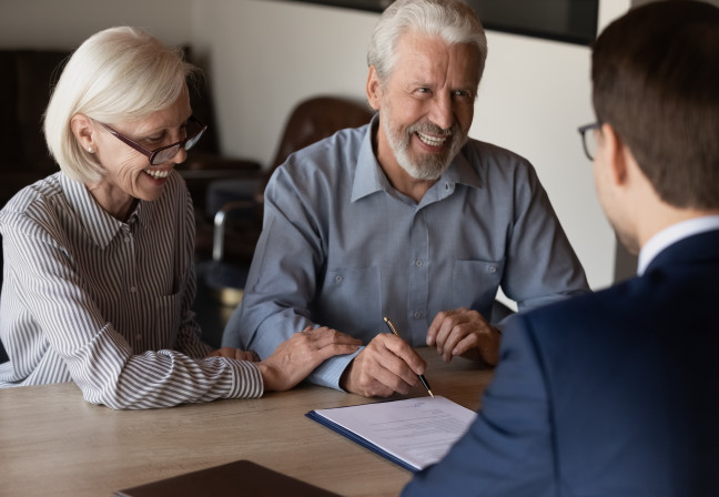 couple signing mortgage origination solution