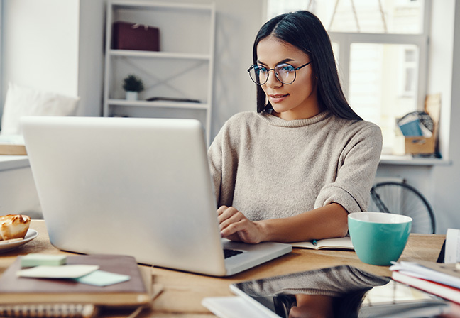 Women at Computer with CRM questions