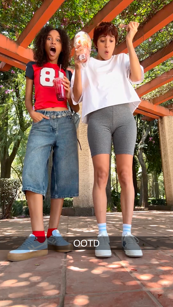 Two creators in streetwear posing to showcase OOTD