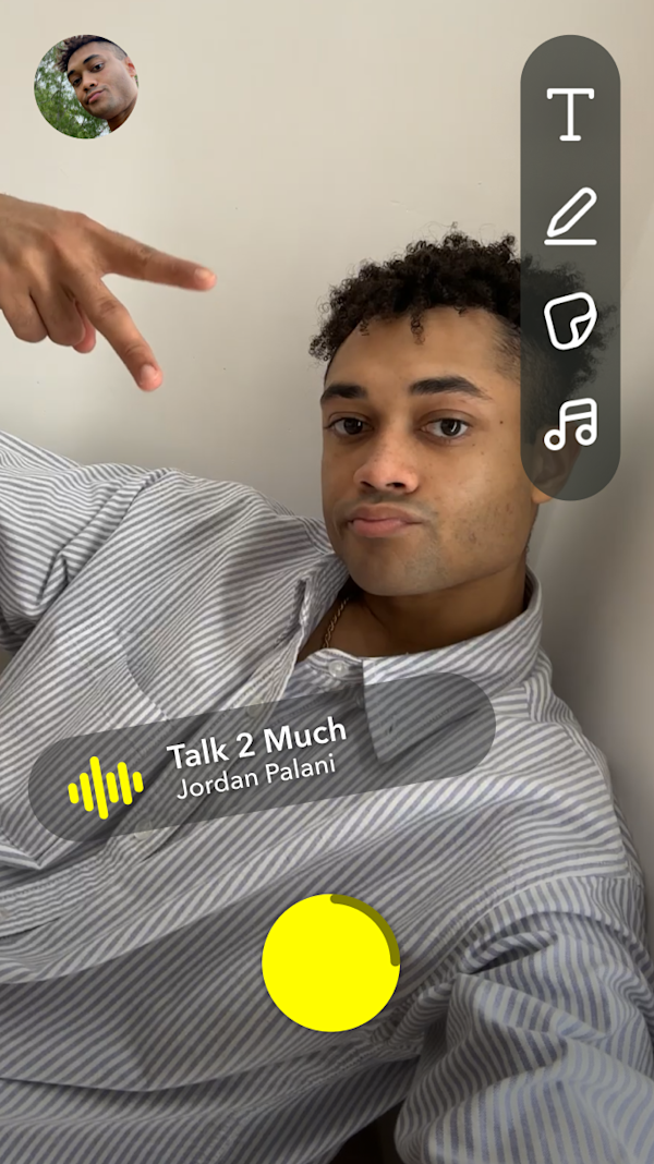 Snapchat camera interface with a user applying a filter and creative tools