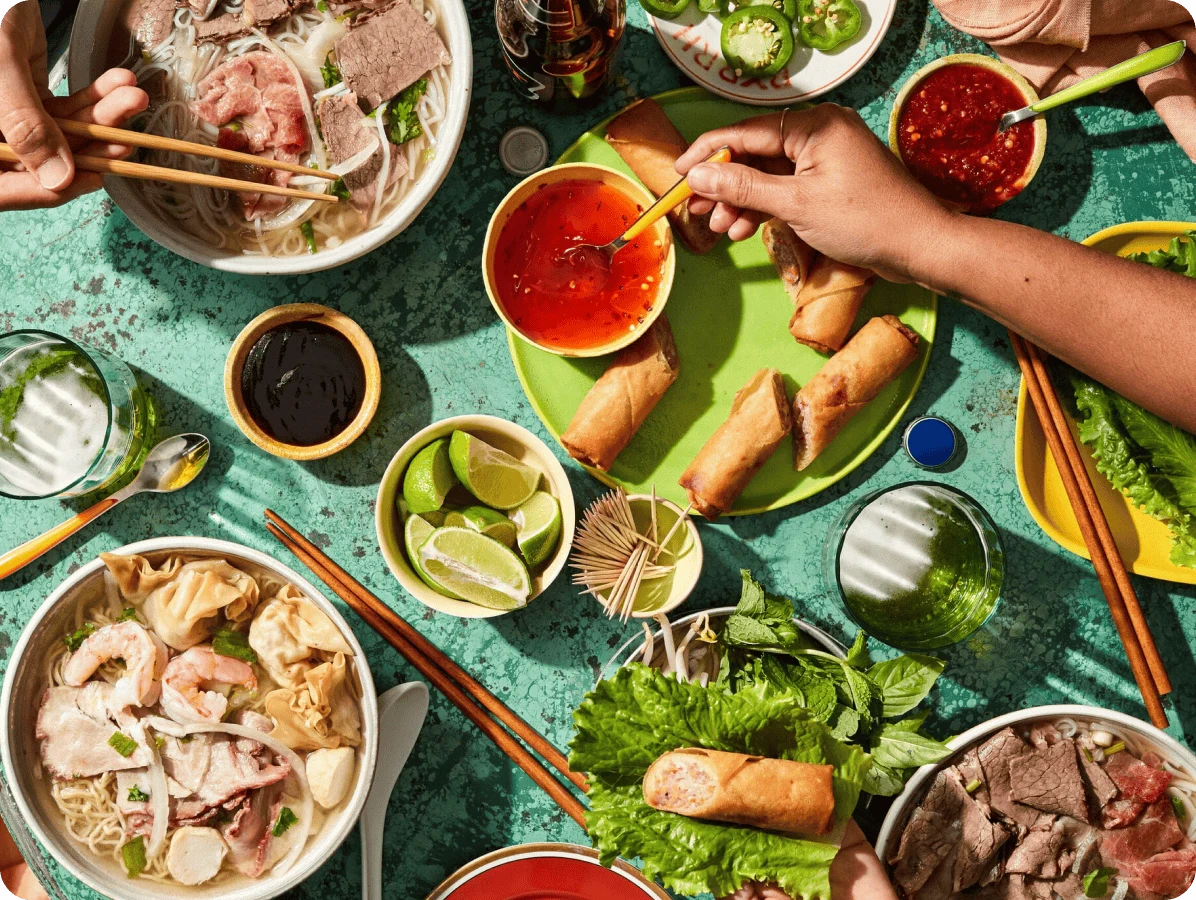 Image of a table with plates of family style food