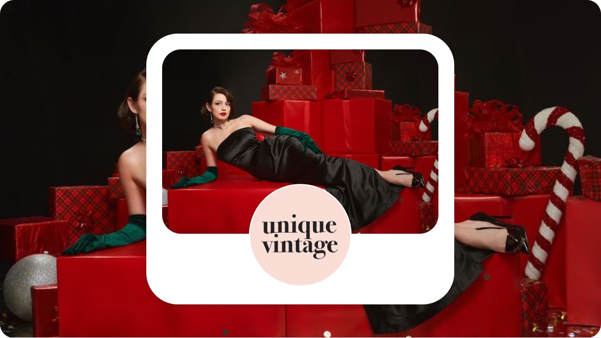 Conceptualised image of a Pinterest profile for Unique Vintage showing a glamorous festive-themed image of a model in an elegant black dress posed on a stack of red gift boxes. The background includes festive decorations such as candy canes and ornaments.