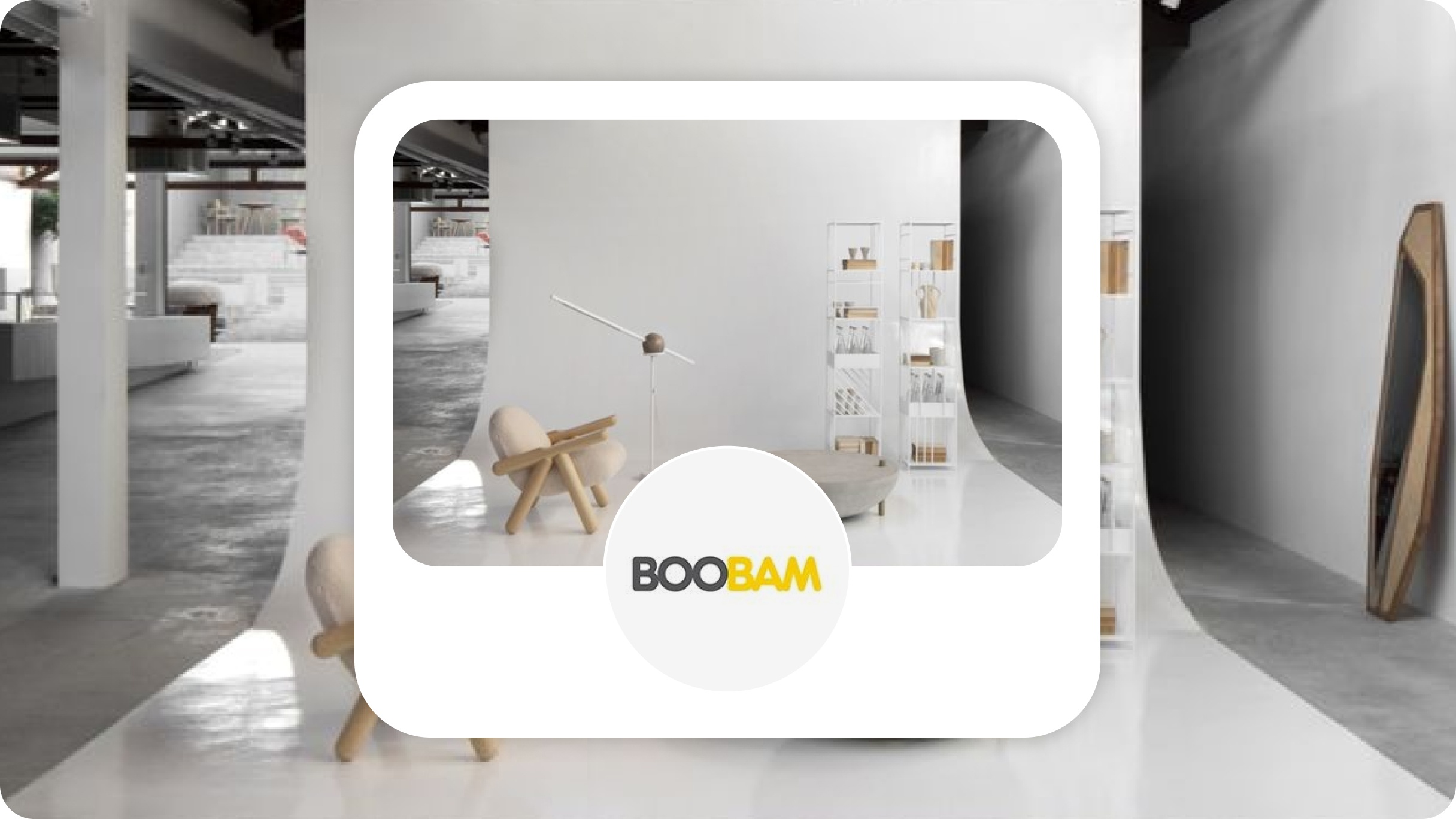Conceptualised image of a Pinterest profile for Boobam featuring an image of a modern, minimalist interior with white walls and polished concrete flooring.  A light wooden chair is next to a sleek, modern lamp and a shelf filled with decorative items.
