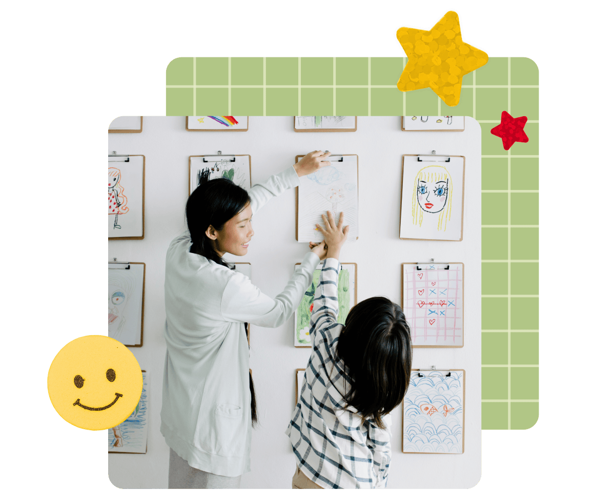 Pin image of a teacher helping a student hand their artwork