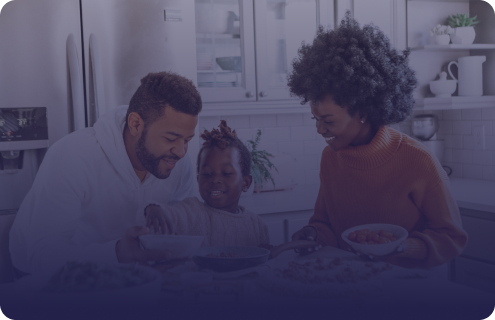 Family eating breakfast together in a kitchen