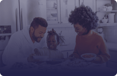 Family eating breakfast together in a kitchen