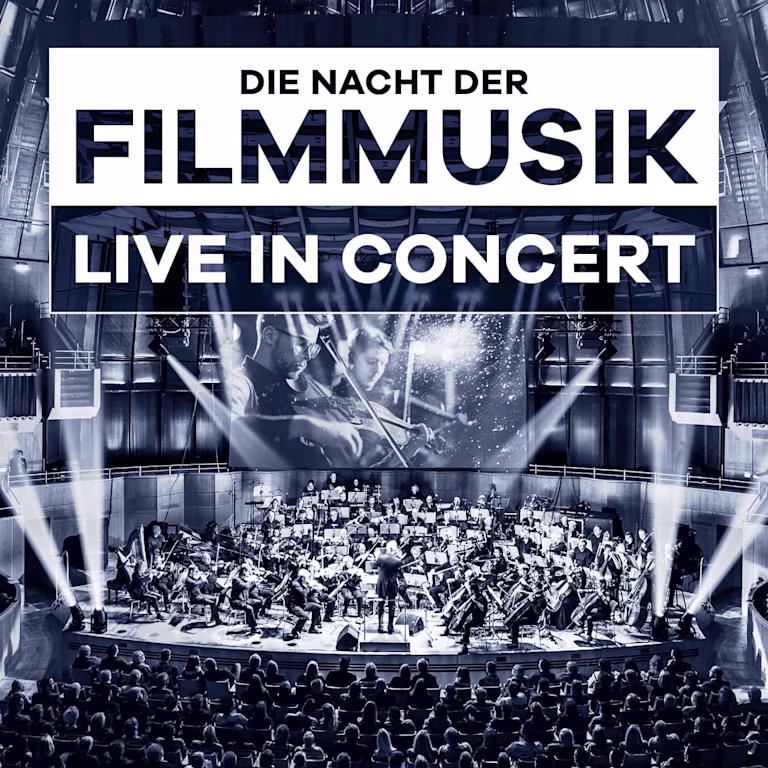 Sinfonieorchester spielt Filmmusik live in großem Konzertsaal vor Publikum