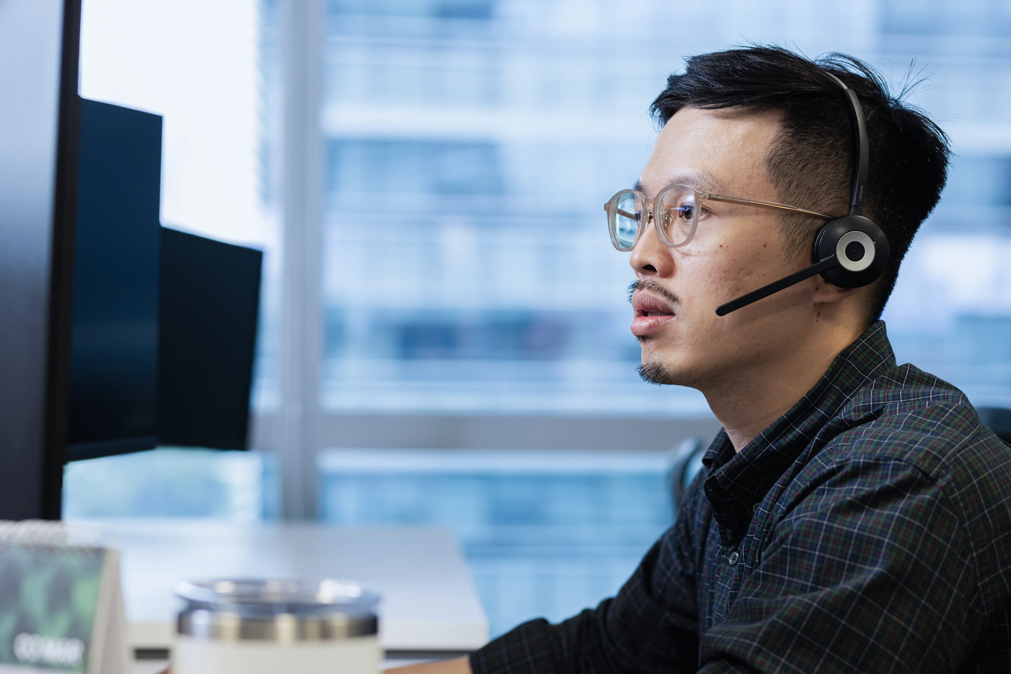 Customer service employee taking calls on a headset