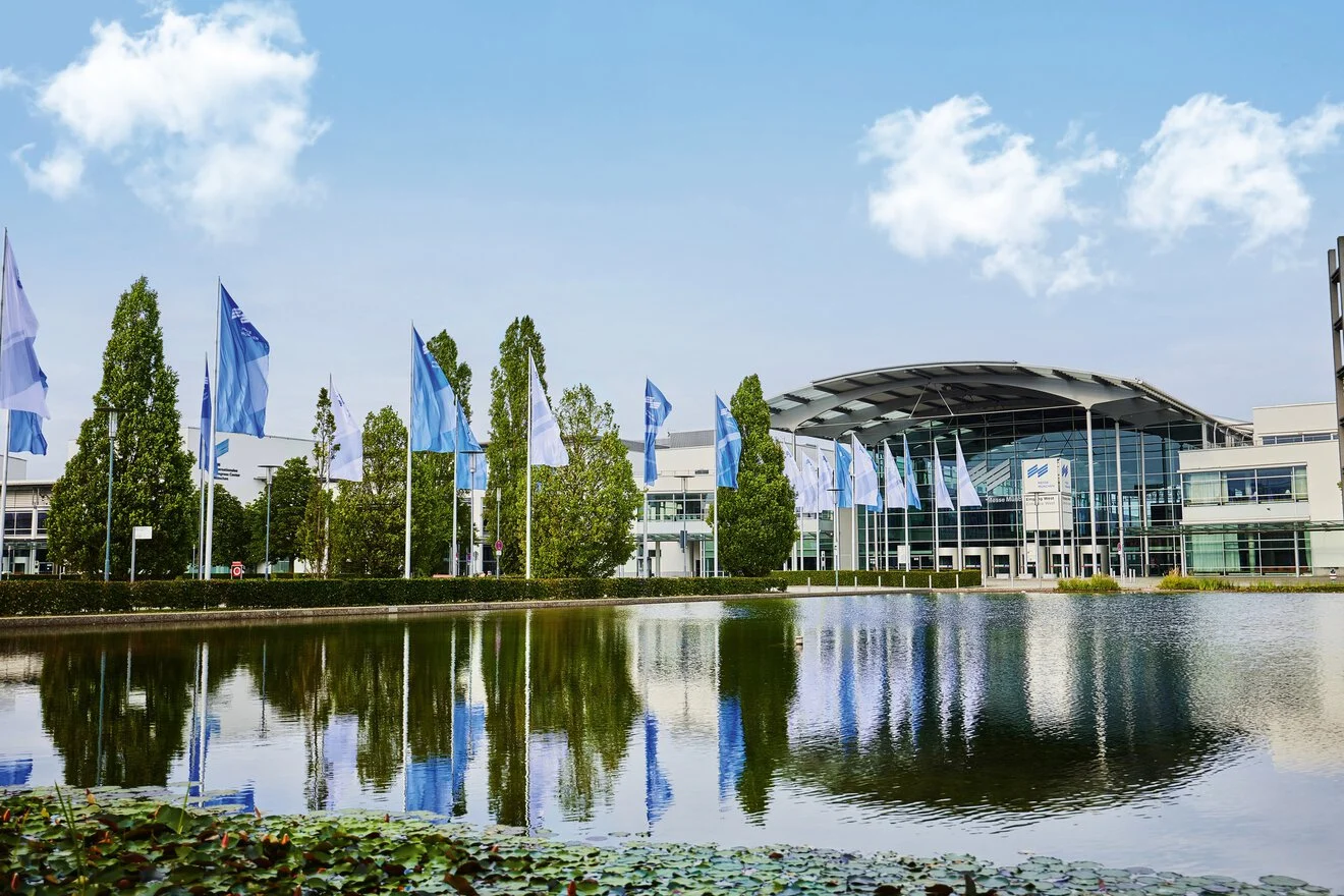 Fusion Worldwide electronica meeting page featuring the Munich exhibition center and a schedule a meeting call to action.