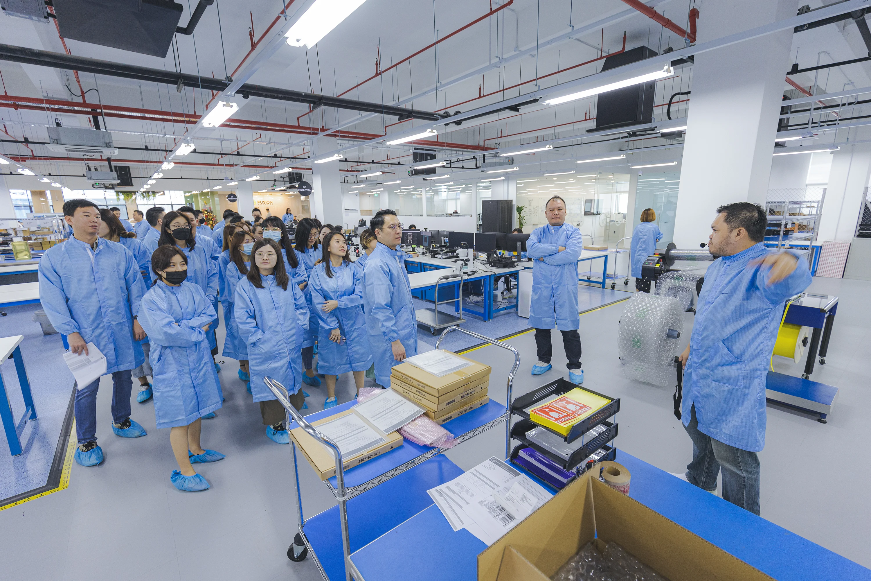 Group of Fusion Worldwide and Prosemi engineers in a quality testing facility