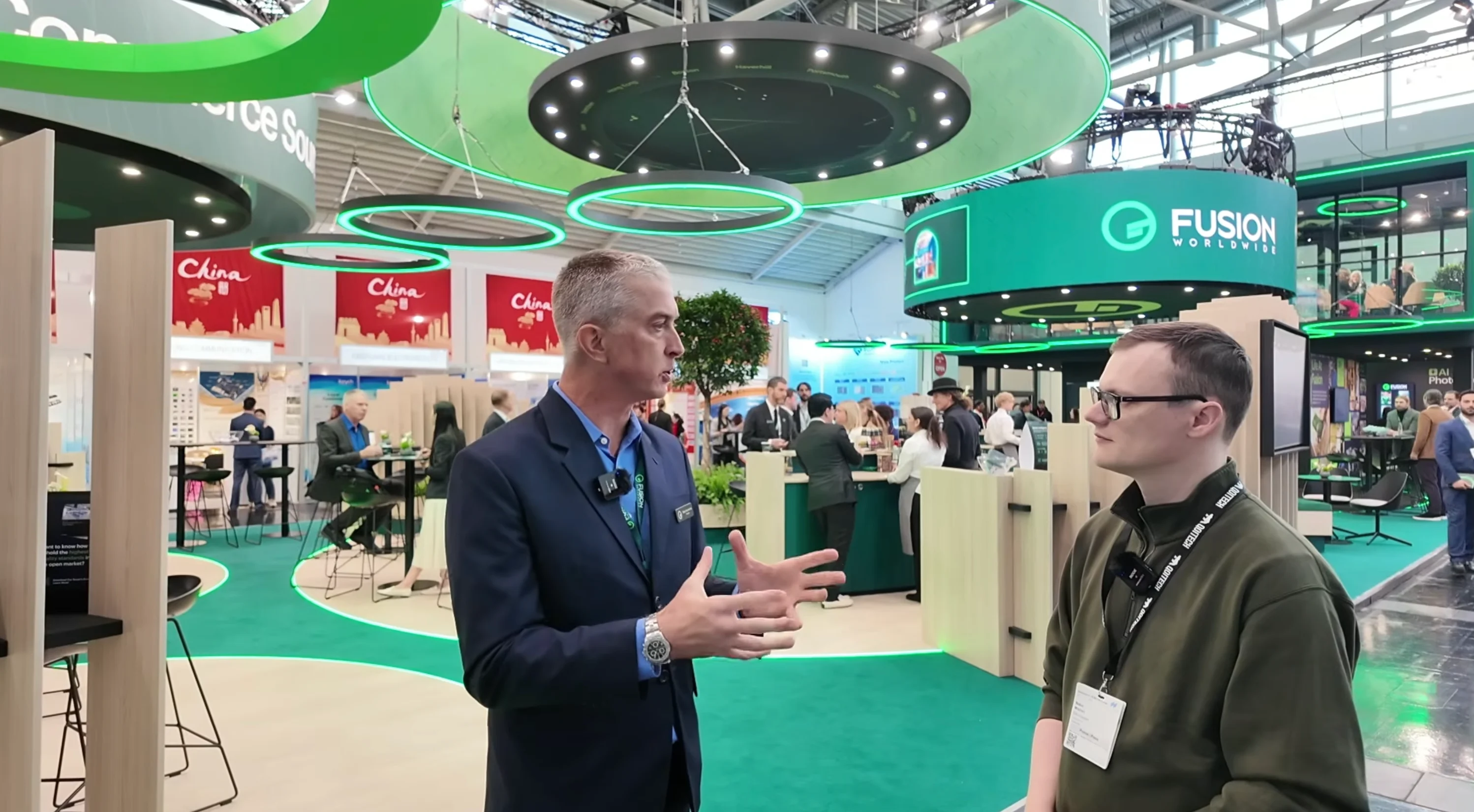 Fusion Worldwide expert interview at electronica trade show booth discussing global electronic component sourcing and market trends.