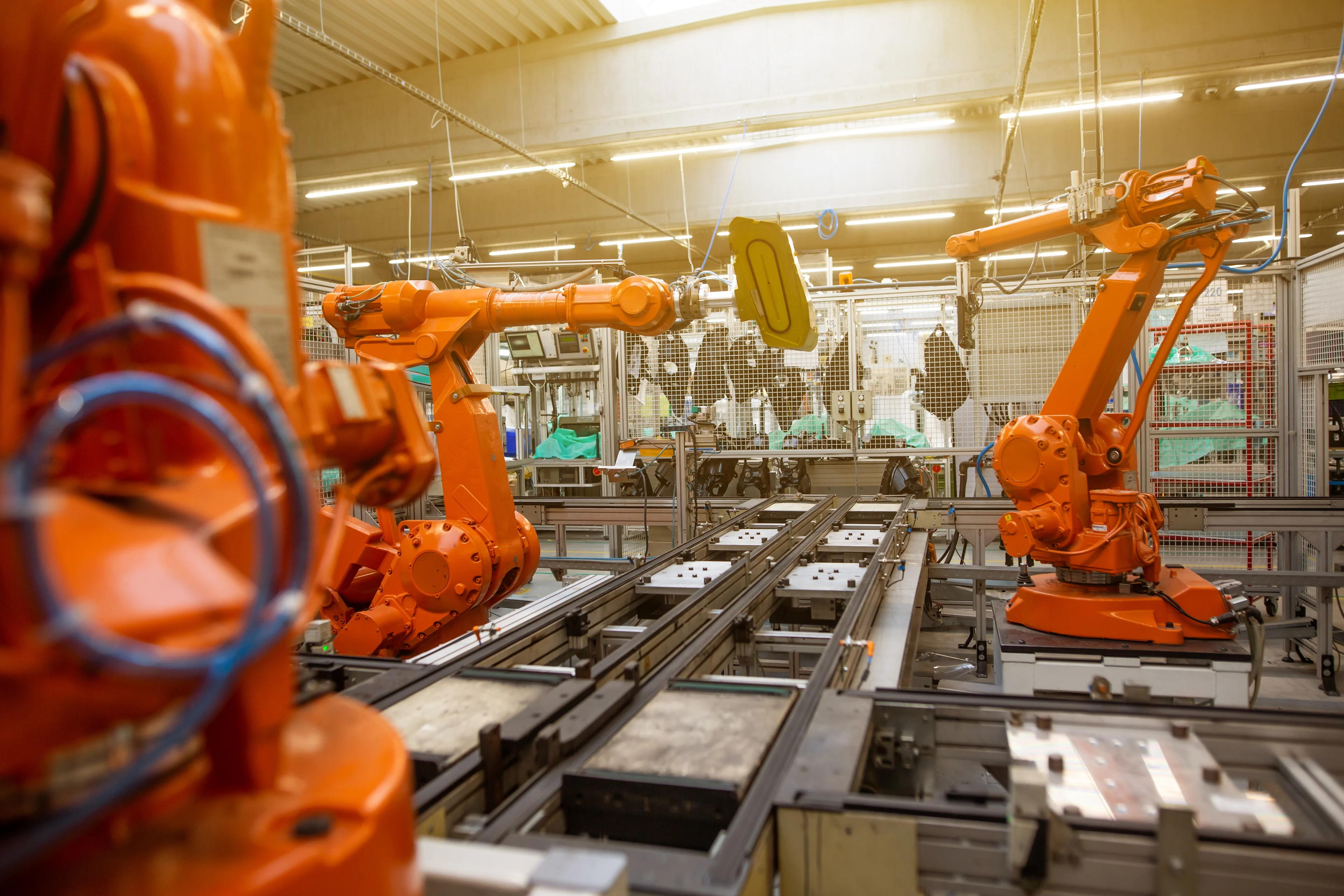Automated robots on an assembly line at an industrial facility