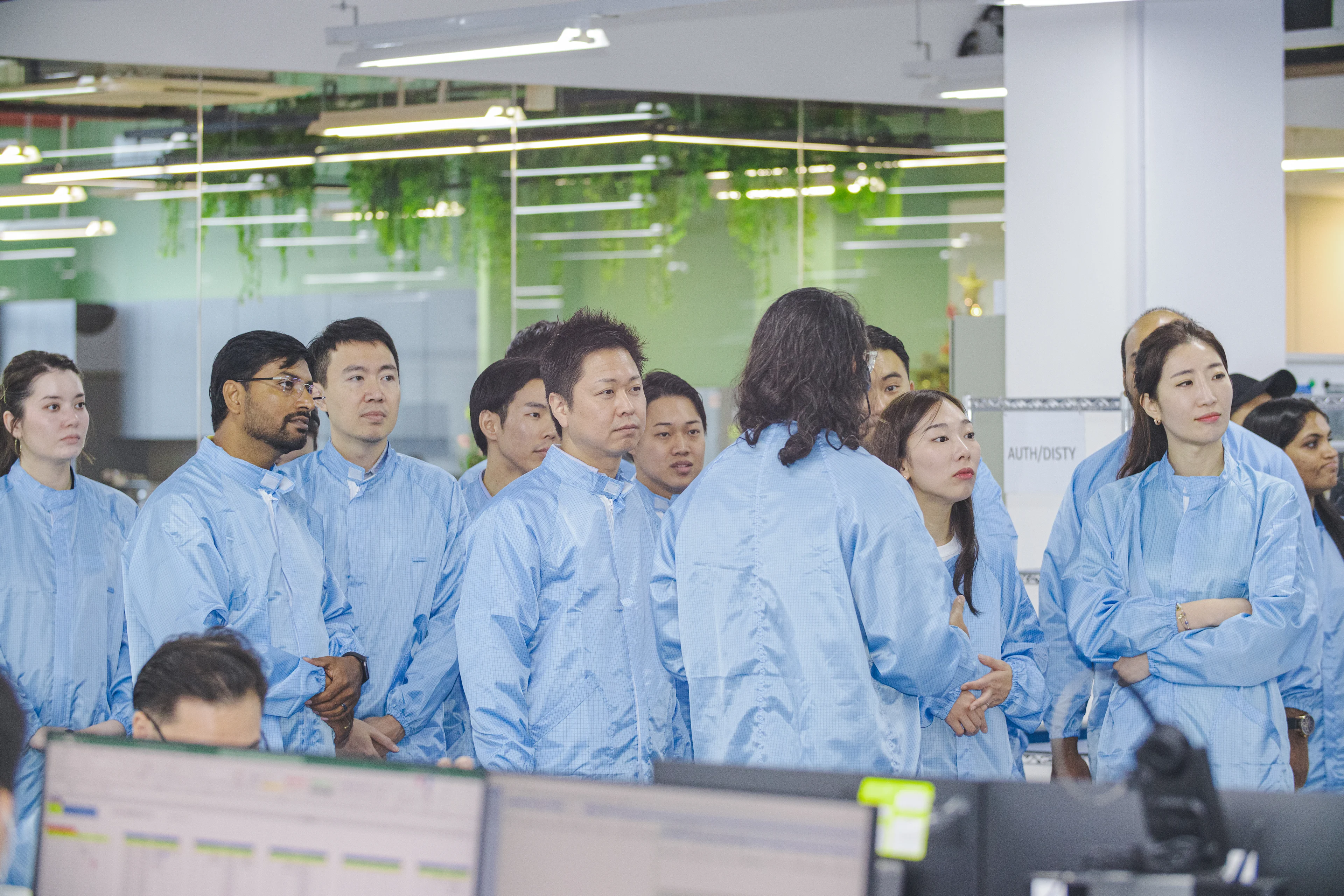 A few of Fusion Worldwide's quality inspection team members standing in a testing facility