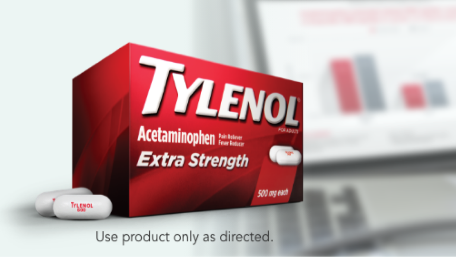 Package of TYLENOL® Extra Strength Caplets and a desk with a laptop and pamphlets.