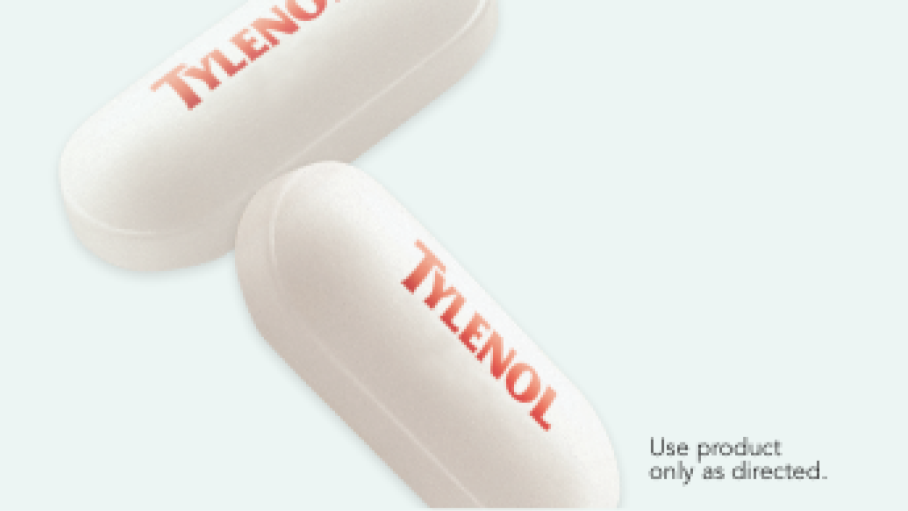 Closeup of two TYLENOL® Extra Strength Caplets with acetaminophen – Use product only as directed.