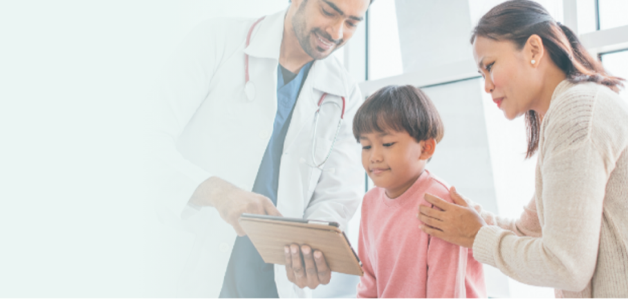 A doctor showing a tablet device to a pediatric patient and their parent.