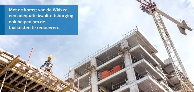 Construction site with a crane and a building under construction, with a worker on scaffolding.