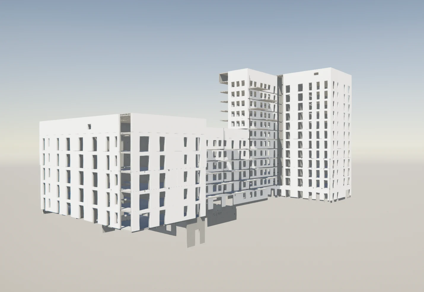 A white, modern apartment building with many windows and balconies is shown from a side angle against a pale blue sky.