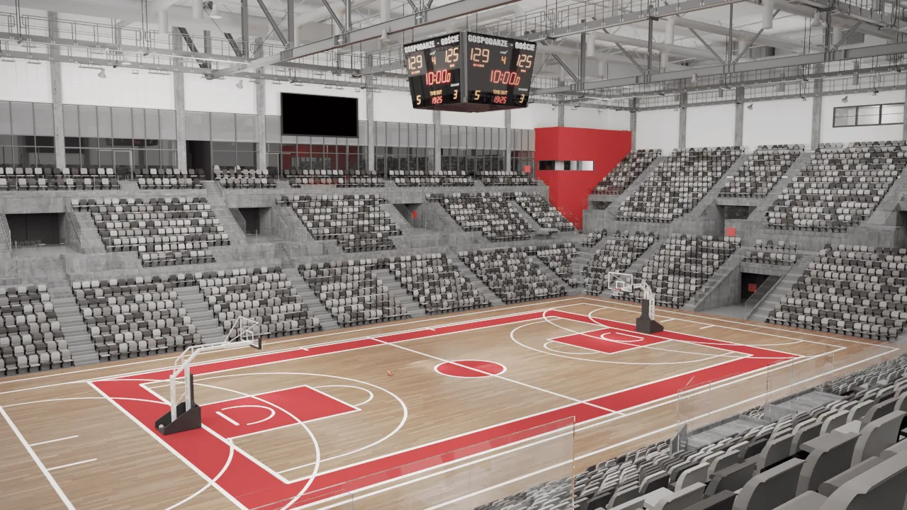 Empty basketball arena with red and white court markings and seating.