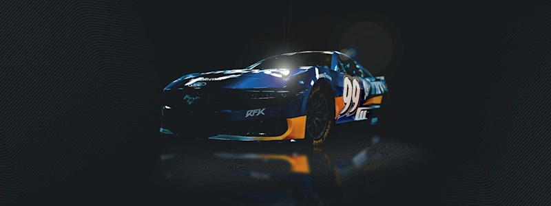A blue RFK Racing #99 NASCAR Ford Mustang with Trimble branding and yellow accents, shown in a dark studio setting.