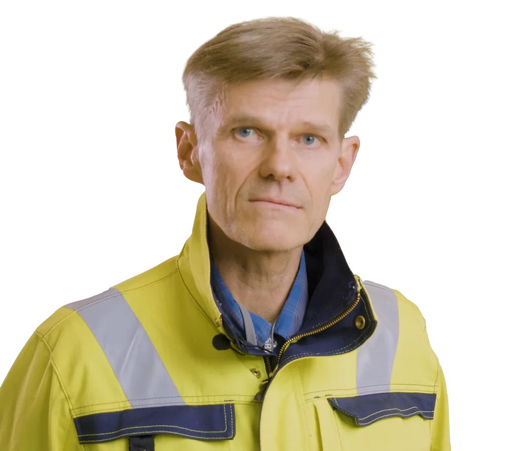 Portrait of a man in a high-visibility yellow jacket.