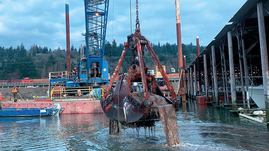 Clamshell dredge bucket full of material