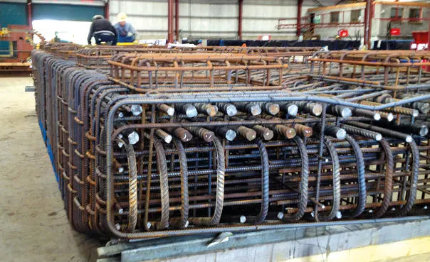 Custom-fabricated rebar cages ready for concrete pouring.