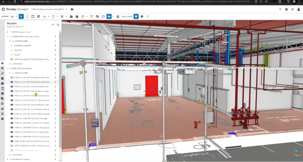 Model of an interior space of the factory showing an open space with exposed installation racks above.
