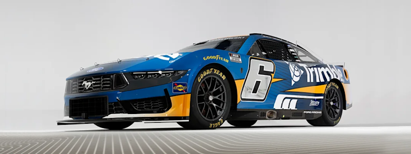 A blue and yellow #6 Ford Mustang NASCAR Cup Series car driven by Brad Keselowski, featuring primary Trimble branding and sponsorship.