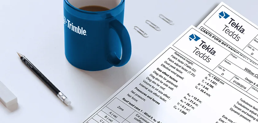 Tekla Tedds calculations printed and laid on desk with Trimble mug