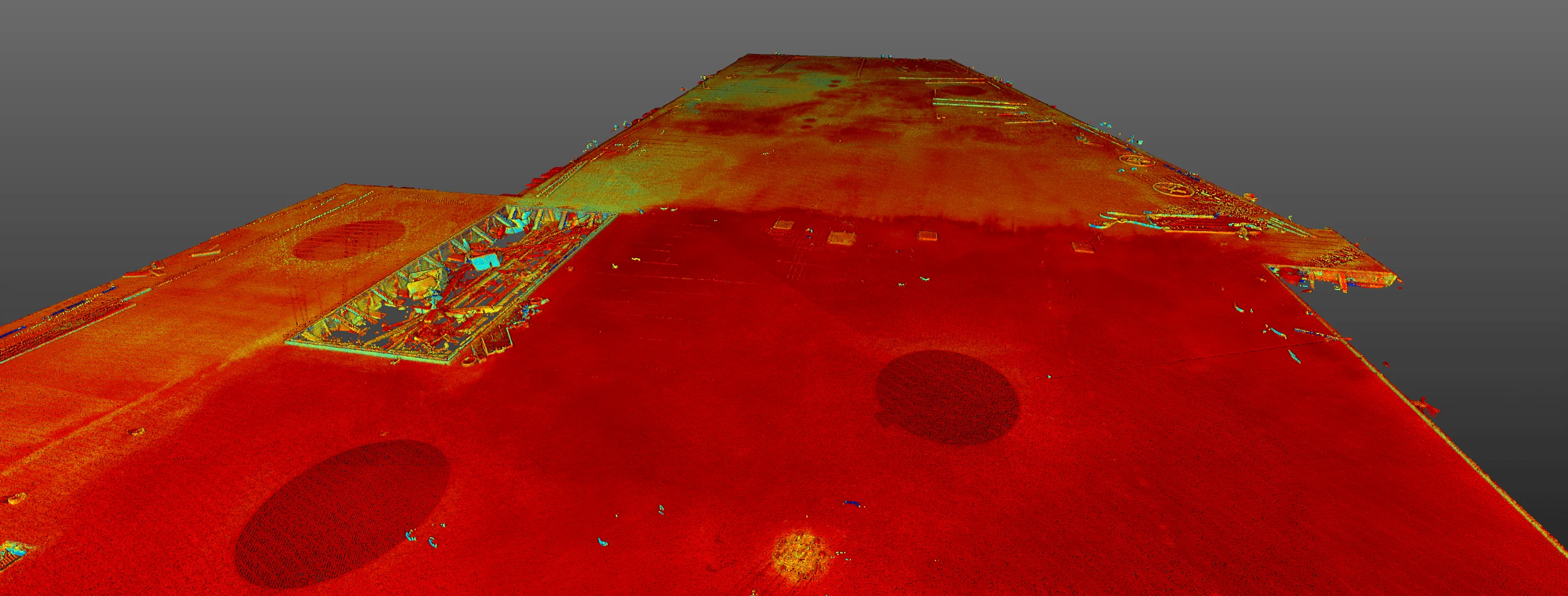 3D point cloud rendering of a construction site, showing terrain variations with a red and yellow color scheme.