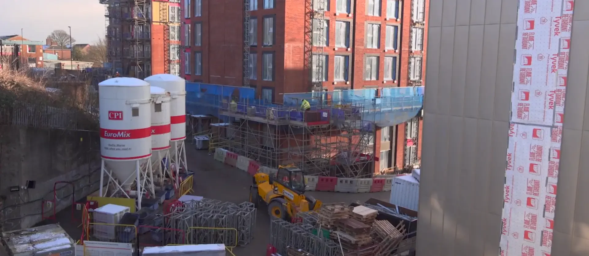 Rochdale Riverside Project site with scaffolding, machinery and building materials.