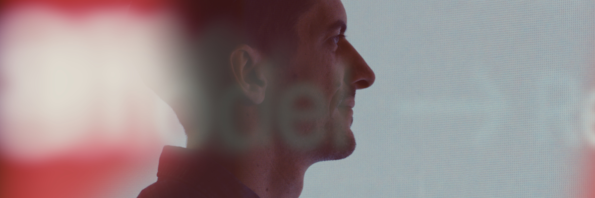 Sideview of Nick Mason headshot.