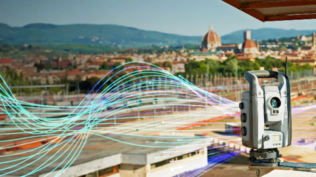 Surveying equipment overlooking a cityscape with digital wave graphics.