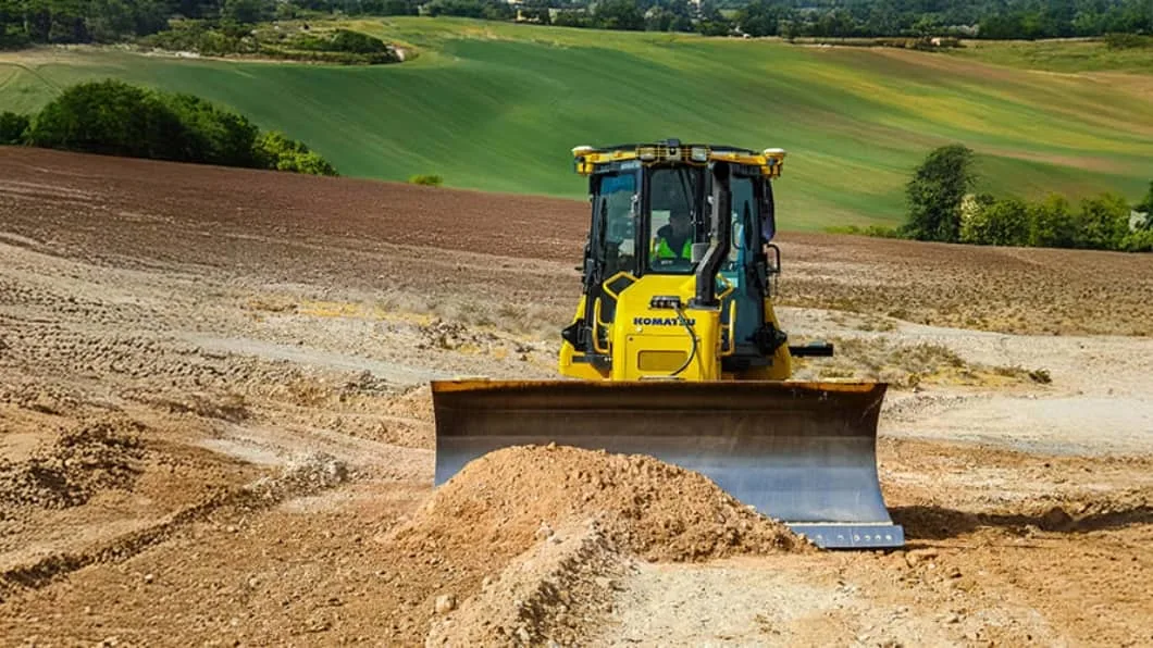 A machine with Trimble machine control is moving dirt on a jobsite.