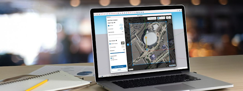 A laptop on a desk displays a satellite map with SketchUp drawing and editing tools on the screen.