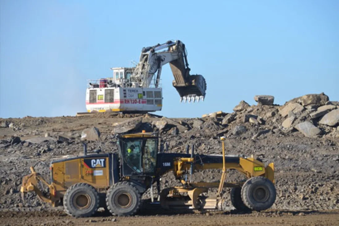 Motor grader and excavator working