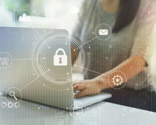 Digital security overlay of locks over a laptop with women's arms typing.