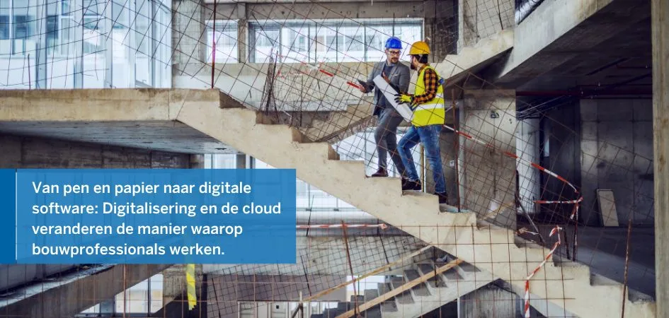 Two construction professionals, stand on a concrete staircase discussing blueprints at a construction site.