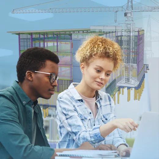 A young man and woman collaborate on a laptop with an architectural rendering of a building and construction crane in the background.