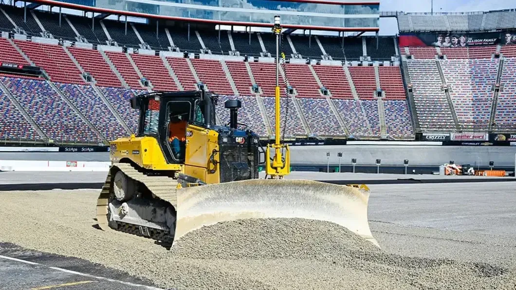 A CAT bulldozer equipped with a Trimble Earthworks Grade Control system grades the surface at Atlanta Motor Speedway.
