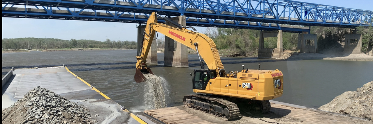 An excavator equipped with TMC removes bedrock from the Missouri River