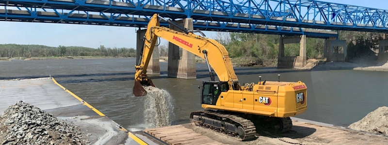 An excavator equipped with TMC removes bedrock from the Missouri River