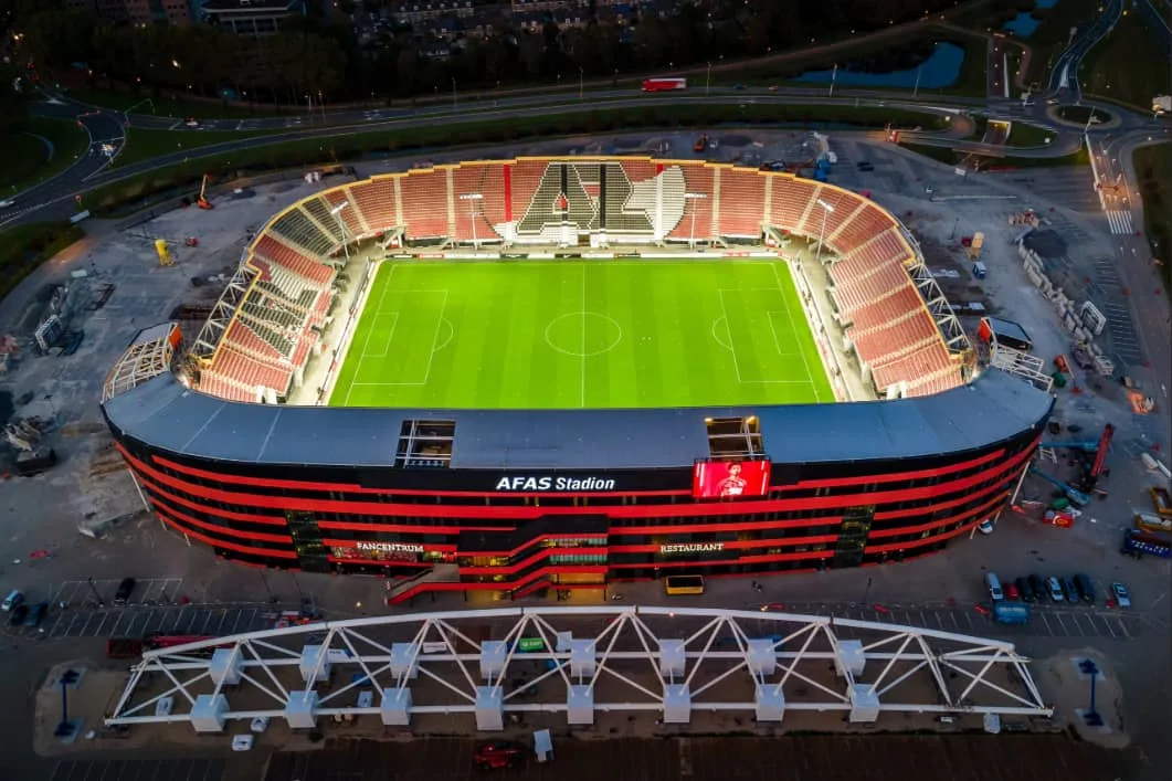 Aerial view of the AFAS Stadion with a soccer field and spectator seats.