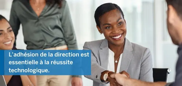Business professionals shaking hands, with text overlaying the image.