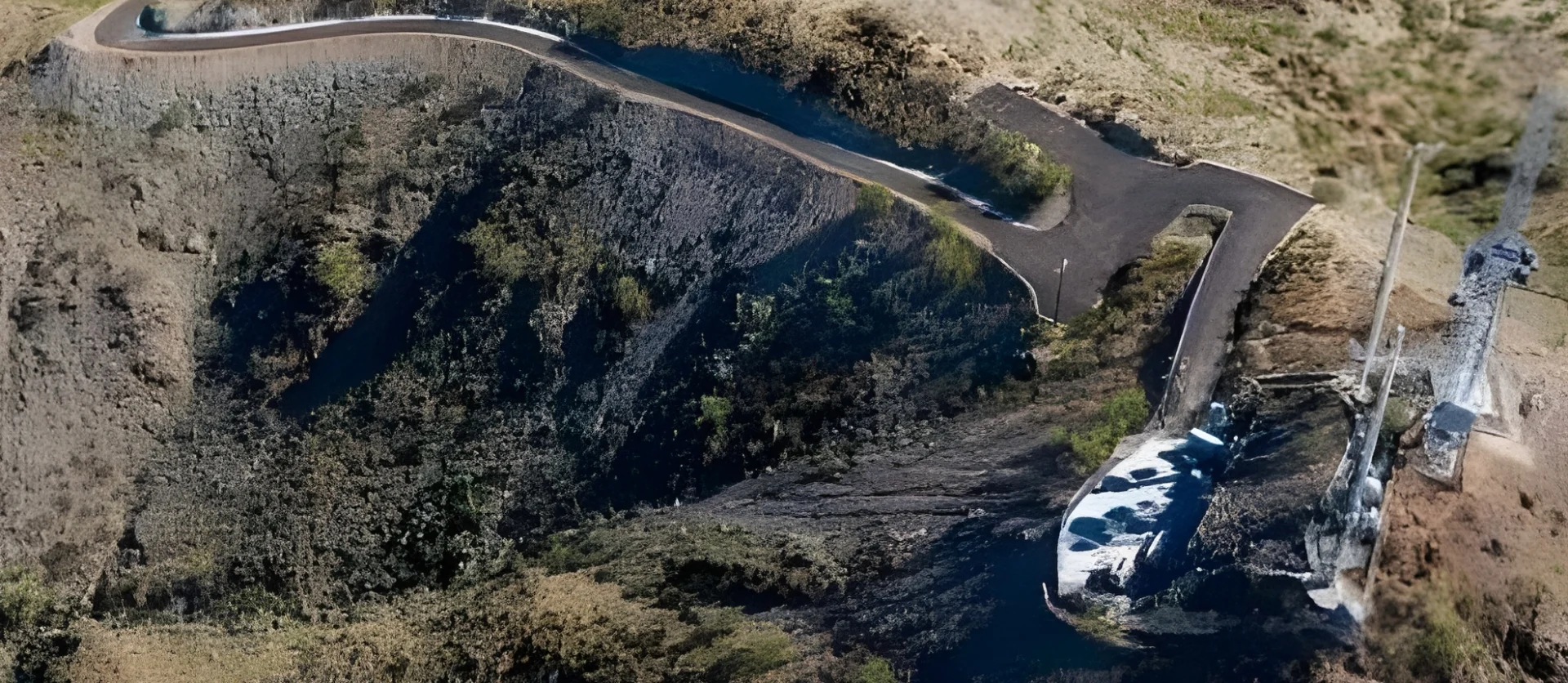 Overhead view of a winding road and communication towers atop steep, rugged terrain on North Mountain.