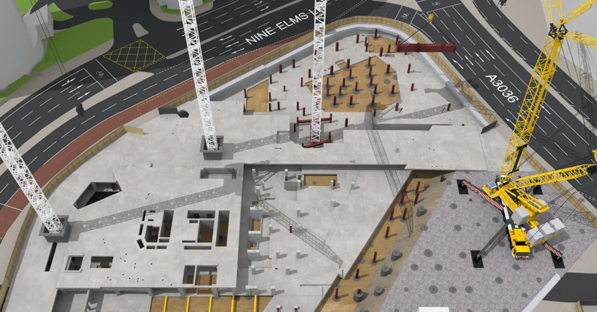 Aerial view of the One Nine Elms construction site, showing the foundational work in progress with multiple cranes and concrete pillars.