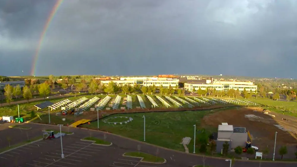 Rainbow over solar panels