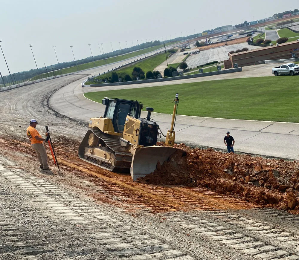 Dozer working on angle of speedway